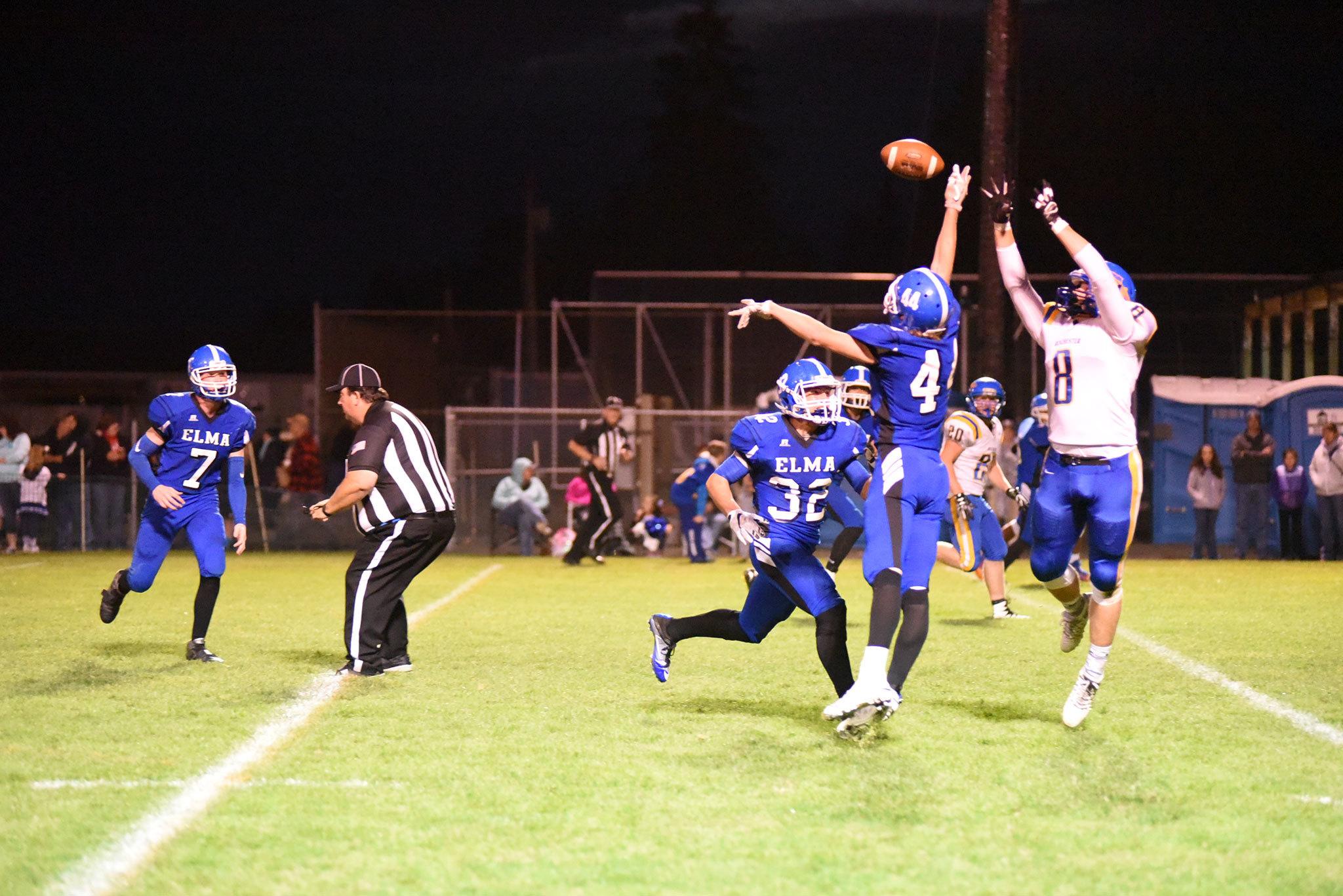 (Photo by Sue Michalak) Elma Eagle Jon Yates, a senior, blocks a pass in a contest against Rochester on Friday, Sept. 30.