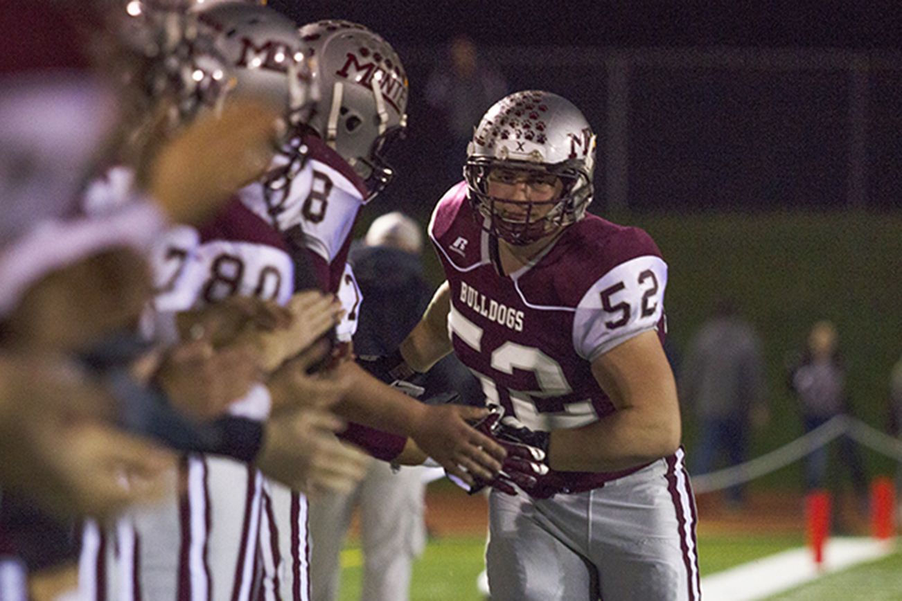 Photo by Justin Damasiewicz Montesano senior Taylor Rupe collects low-fives from his teammates as he is introduced for the last time at Jack Rottle Field prior to a District IV crossover playoff game against White Salmon on Friday.