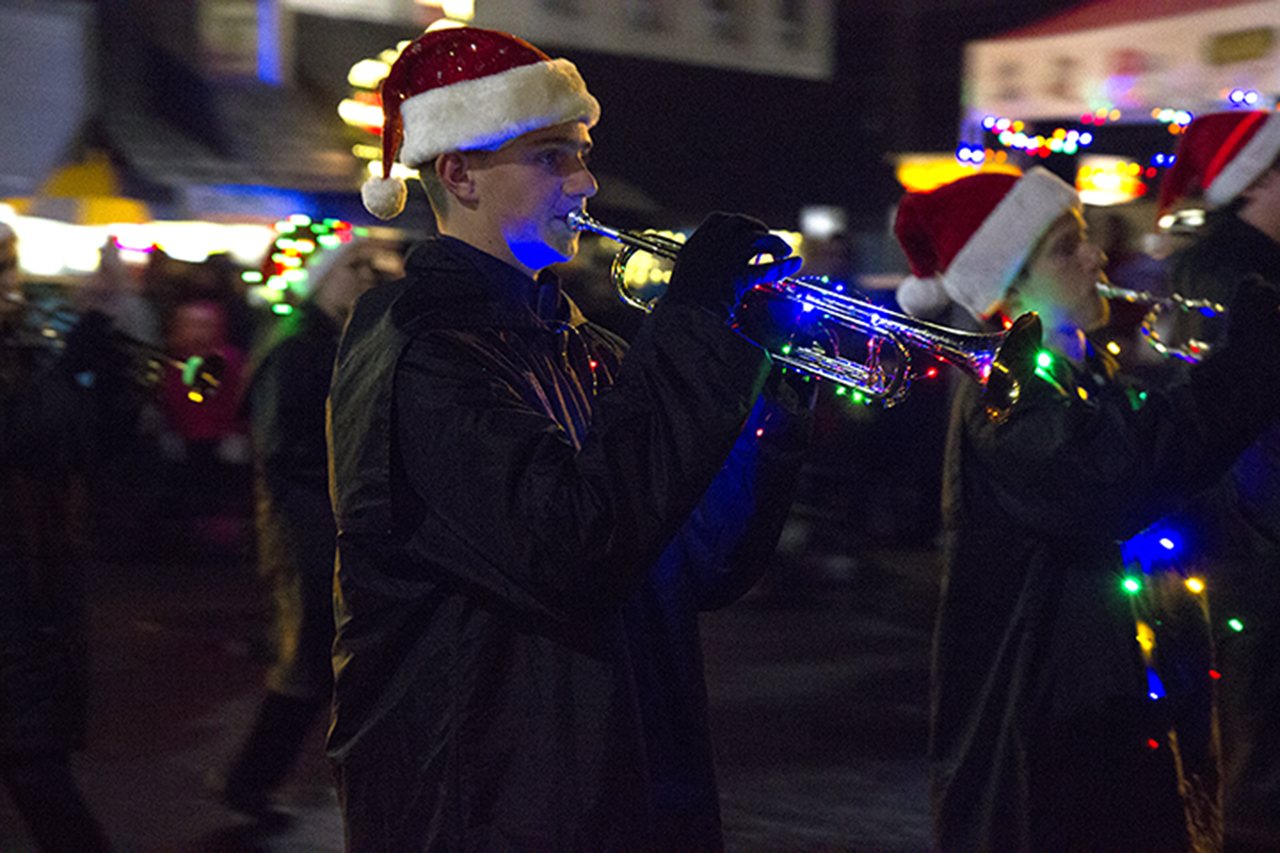 (Corey Morris | The Vidette) Color from holiday lights brightens up the trumpet and chin of Ben Wills of Montesano High School during the 30th annual Montesano Festival of Lights on Dec. 12, 2016.