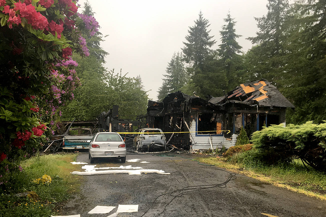 (Dan Hammock | Grays Harbor Newspaper Group) The fire Thursday morning in Central Park destroyed the home, vehicles and possessions of a family of four. The cause of the fire is still under investigation.