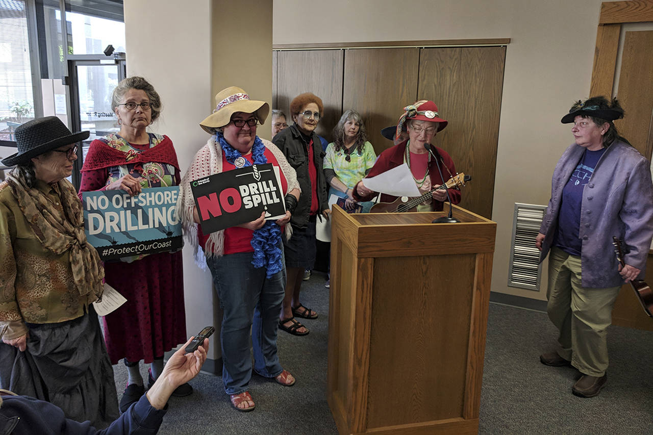 Corey Morris | The Vidette The “raging grannies” prepare to play ukuleles and sing a song about offshore oil drilling for the Grays Harbor County commissioners.