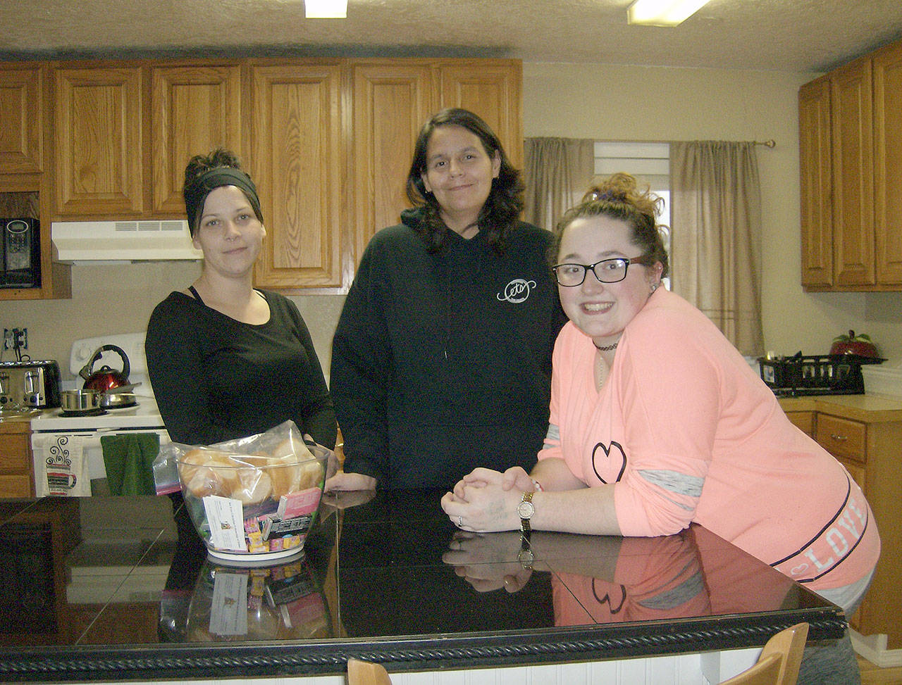 From left, Julya Lemon, Angel Callahan and Christina Watkins pose in the kitchen at the House of Ruth, where they are the first three residents of the women’s ministry at Set Free Christian Fellowship in 11 years. Photo courtesy Tommi Halvorsen Gatlin