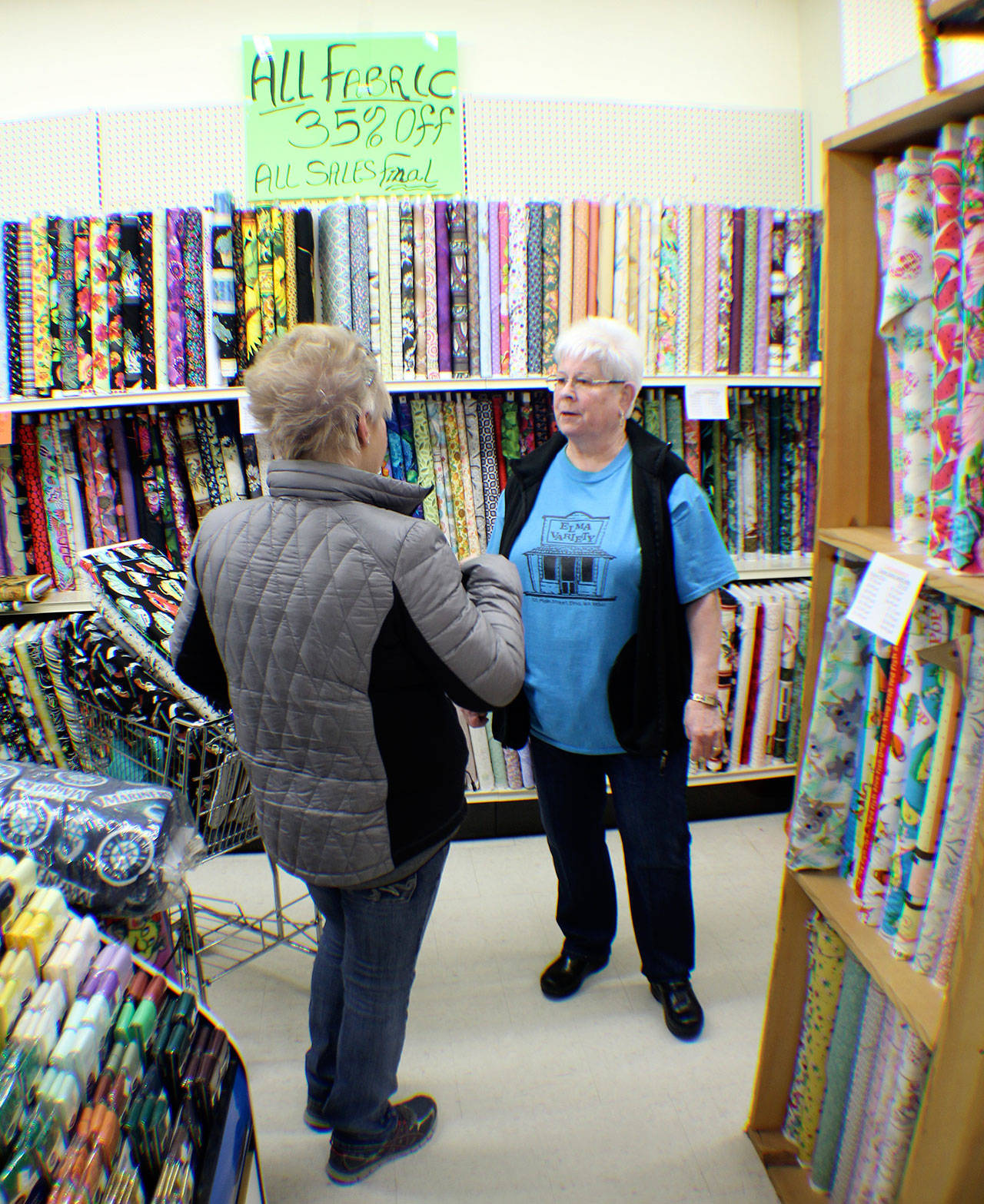 Carol Morrow chats with a customer Friday, March 1, 2019, at Elma Variety Store. She is selling the store she and her husband, Boyd, owned for more than 40 years. The customers started lining up early Friday for a liquidation sale. Michael Lang | Grays Harbor News Group