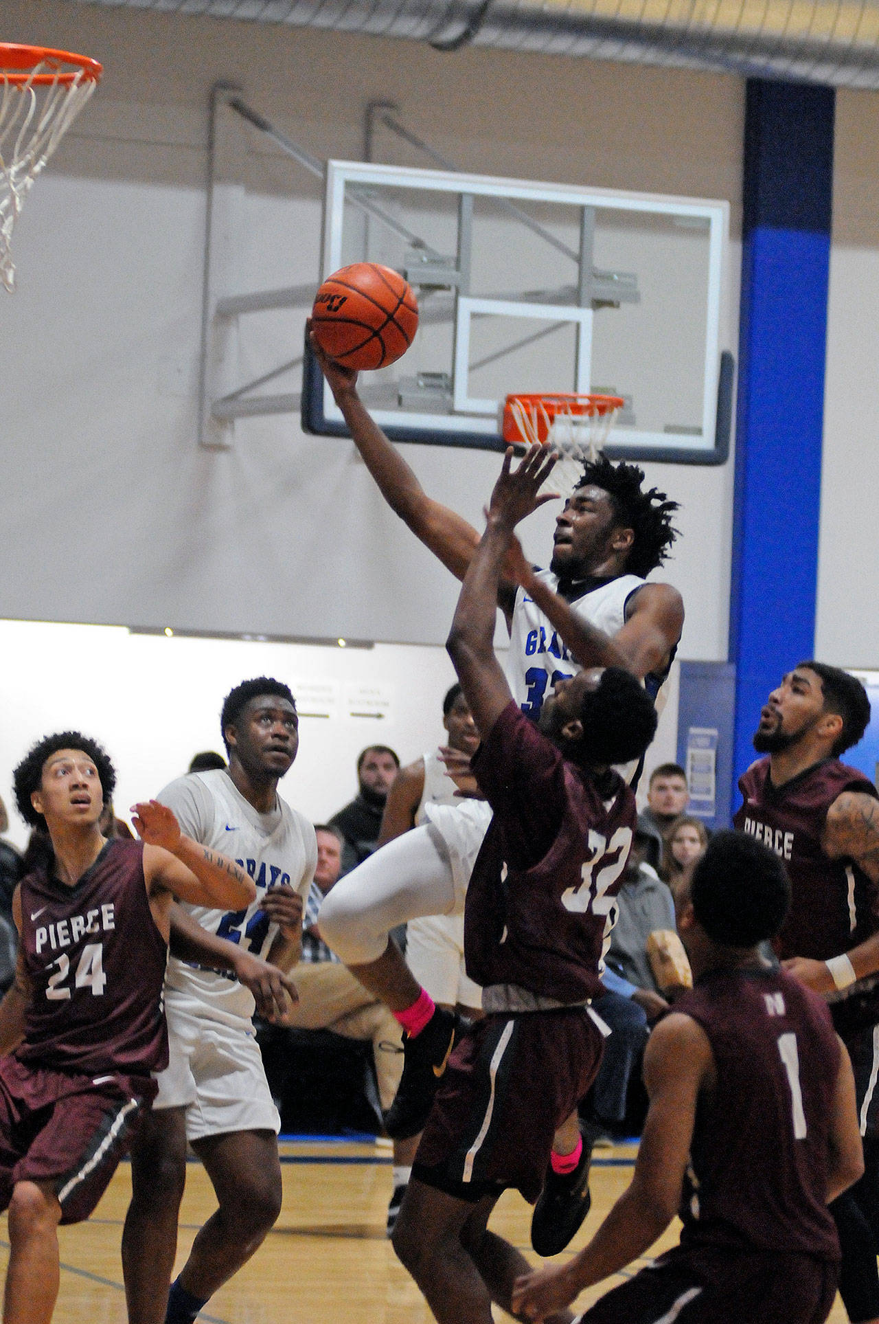 Grays Harbor’s Genuine Powell scores two points on a layup in the second half of the Chokers’ 93-68 victory over Pierce College on Thursday in Aberdeen. Powell scored 22 points to lead Grays Harbor. (Ryan Sparks | Grays Harbor News Group)