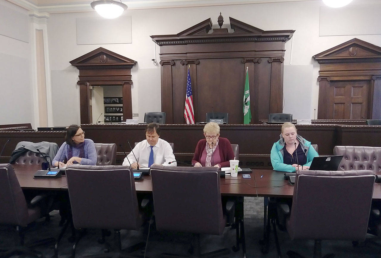 From left, Andrea McNamara Doyle, director at the Office of the Chehalis Basin; board member J. Vander Stoep; board member Edna Fund; and Cindy Bradley take part in an OCB board phonecall Wednesday, Jan. 29, 2020, in Chehalis. (Michael Lang | Grays Harbor News Group)