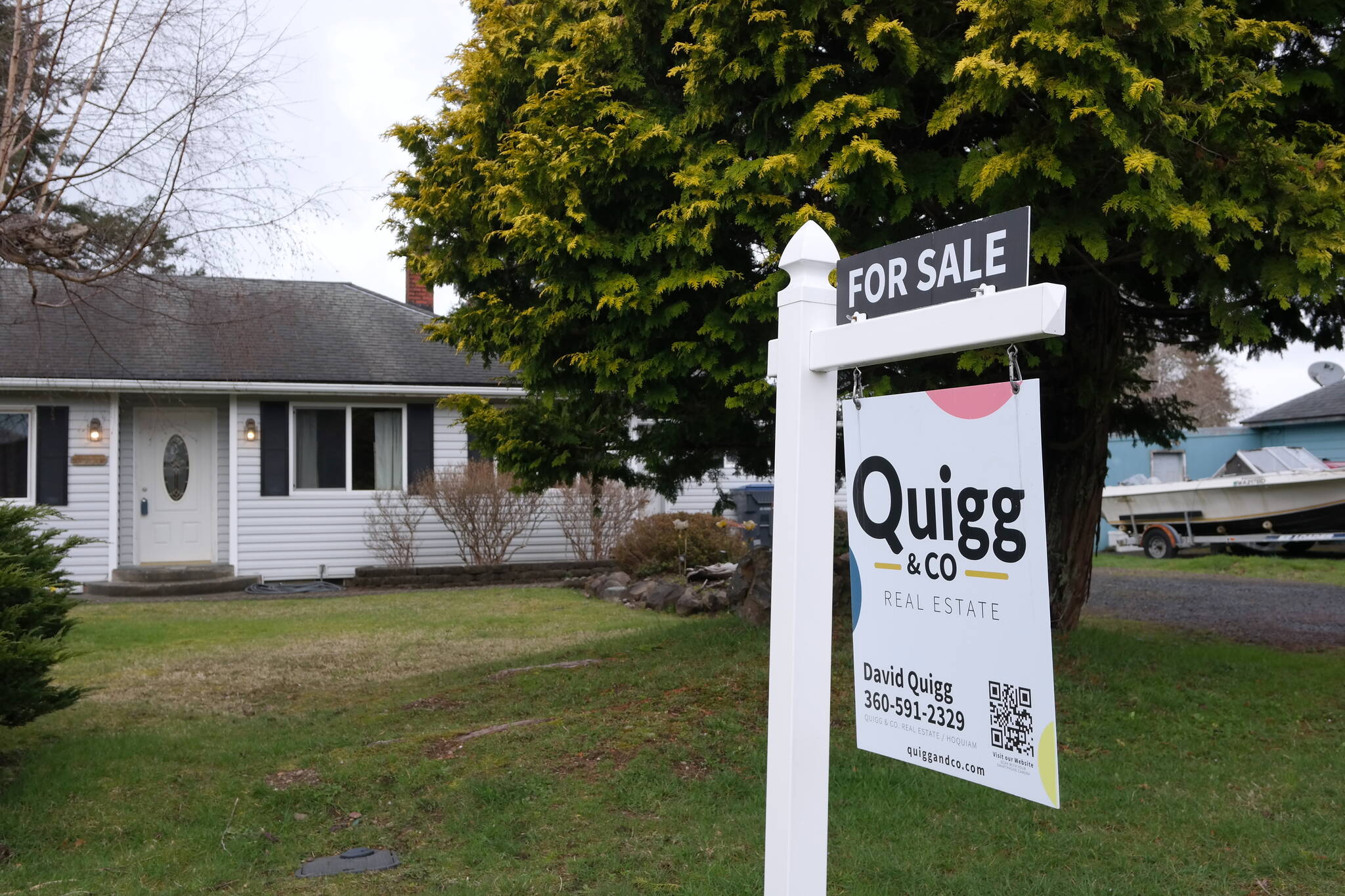 A Quigg & Co Real Estate sign dots the front lawn of home at 1911 Coolidge Road in Aberdeen. Erika Gebhardt | The Daily World