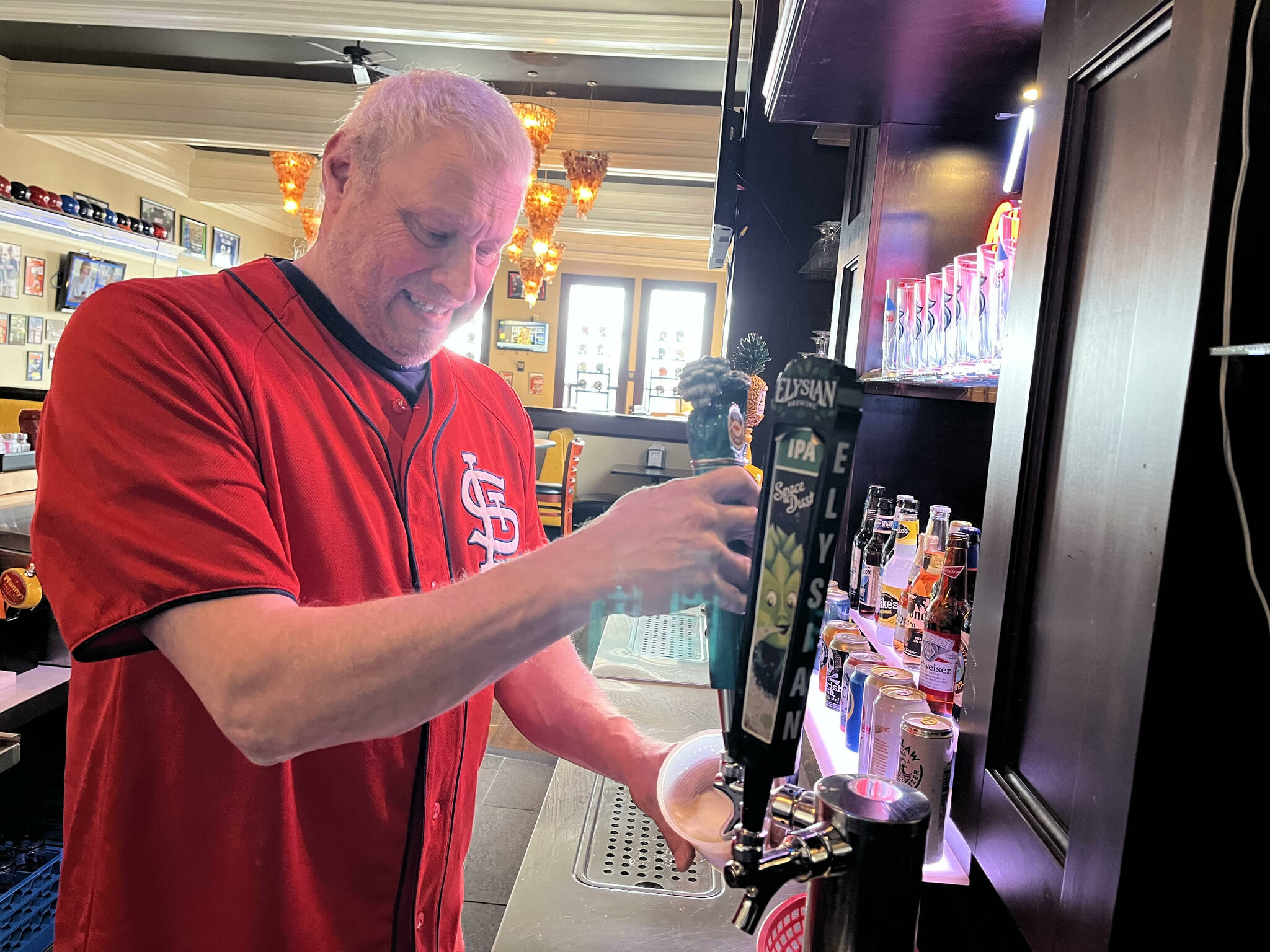 Tom Sutera, owner of Game Day Sports Bar and Grill — 212 S. I St., — pours a Kona Brewing Big Wave Golden Ale at the start of business late Thursday morning, March 31. Matthew N. Wells | The Daily World